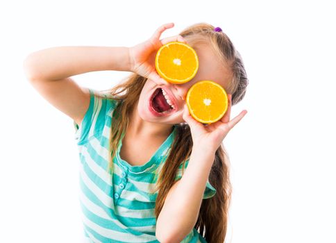 funny little girl with two halves of oranges isolated on white background