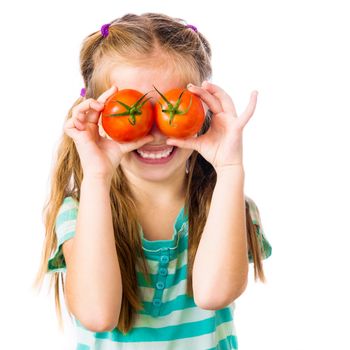 little girl with tomatoes near the eye on a white background