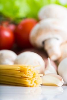 Raw Pasta with vegetables close up