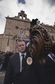 Leaving the Church of San Francisco of the brotherhood of the expiration of Christ ported by men with blue suit, Holy week in Linares, province Jaen, Andalusia, Spain