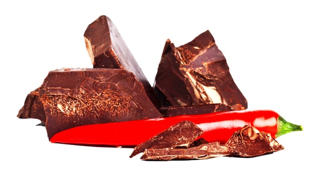 Heap of delicious black chocolate with red chili pepper