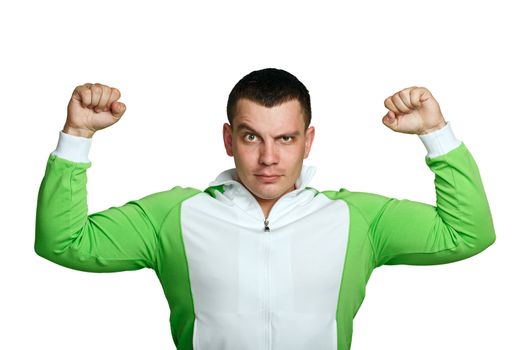 Man in sports suit shows biceps, isolated on white background