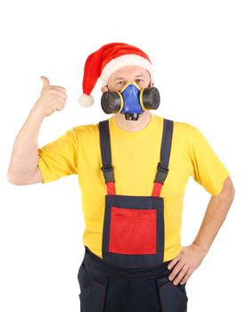 Worker in gas mask and santa hat shows thumb. Isolated on a white backgropund.