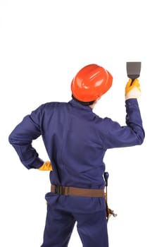 Worker in hard hat working with fretsaw. Isolated on a white backgropund.