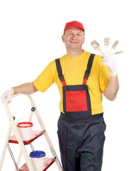 Worker on ladder with brushes. Isolated on a white backgropund.