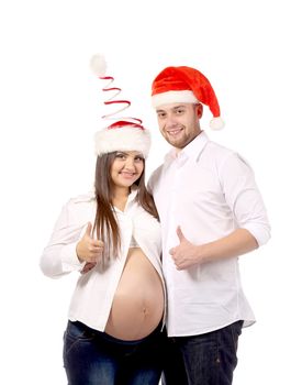 Beautiful couple expecting a baby with red caps