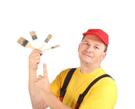 Worker shows painting brushes. Isolated on a white background.