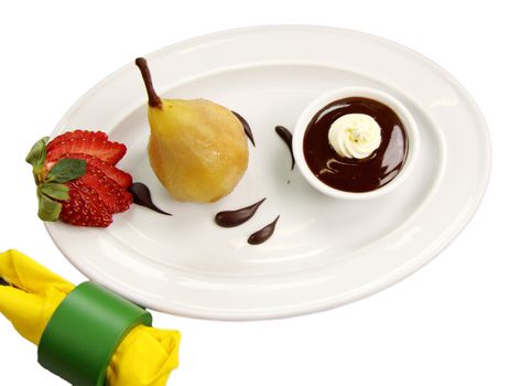 Delicious poached pears in chocolate syrup ready to serve.