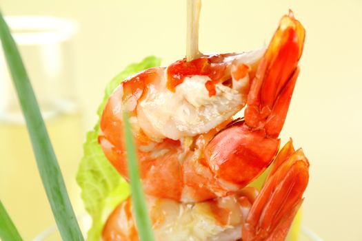 Delicious fresh shrimp cocktail with an avocado salad with spring onions.