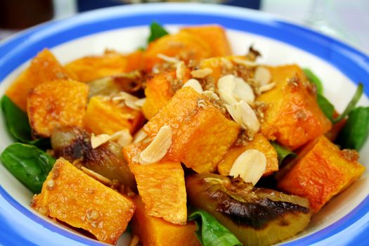 Roasted pumpkin and onion salad with wilted spinach and toasted almonds.