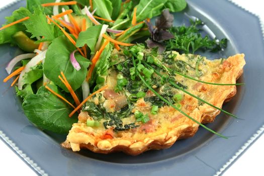Spinach and bacon quiche with a fresh garden salad.