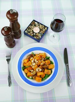 Roasted pumpkin and onion salad with wilted spinach and toasted almonds.