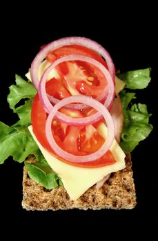 Low calorie rye cracker with ham and salad.