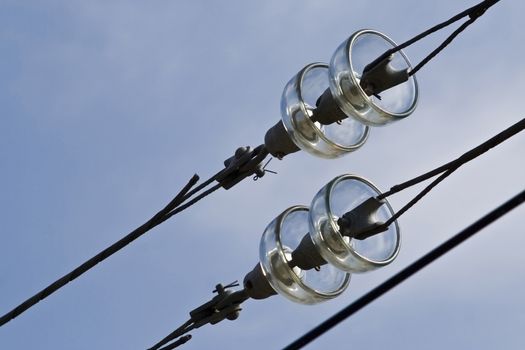 Railroad overhead lines against clear blue sky