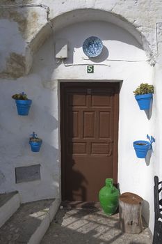 Traditional Andalusian townhouse decorated with flower pots, Iznajar, Cordoba province, Andalucia, Spain