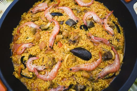 Paella with prawns and mussels, typical Spanish dish, ingredients of the Mediterranean, Spain