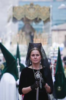 Woman dressed in mantilla during a procession of holy week, Andalusia, Spain