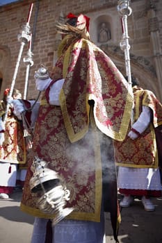 Young people in procession with incense burners in Holy week, Andalusia, Spain