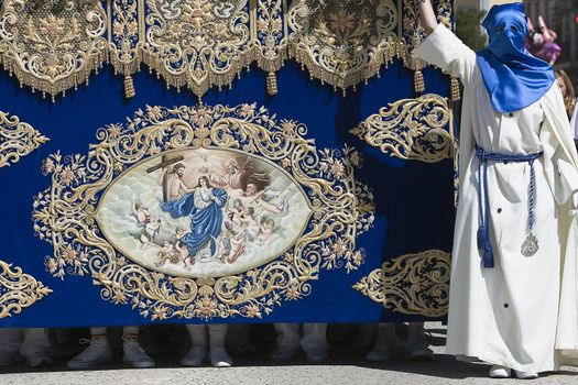 Throne of the Virgin Mary or called palio, embroidered in blue velvet with gold thread, biblical scene embedded on the front, procession of Holy Week, Andalusia, Spain