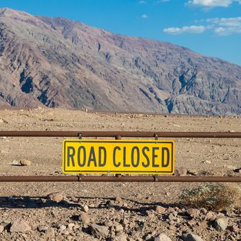 Death Valley, California. Road Closed sign in the middle of the desert.
