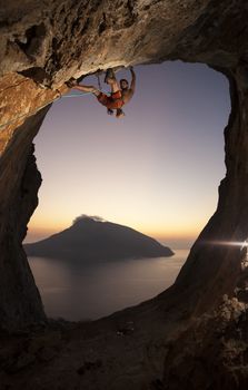 Rock climber at sunset. Kalymnos Island, Greece.