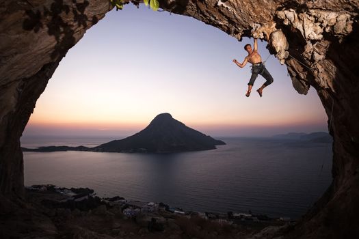 Rock climber at sunset. Kalymnos Island, Greece.