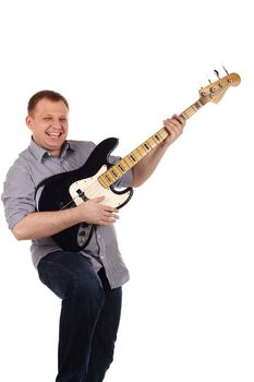 Young man playing guitar isolated on the white