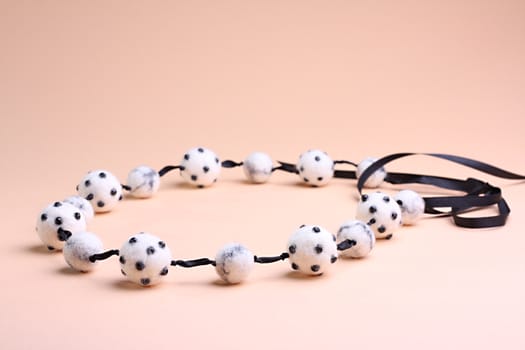 White beautiful beads at pink background