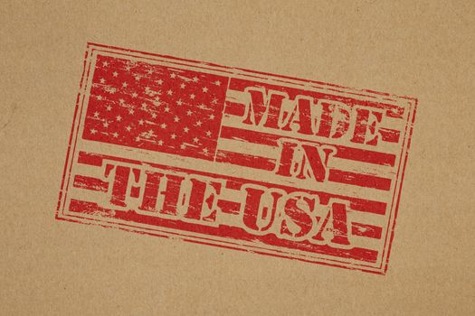 Made in the USA rubber stamp impression on brown paper background
