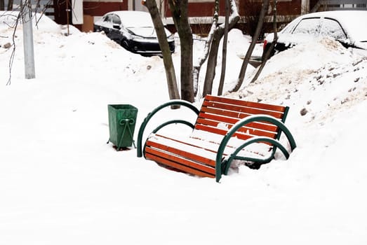 wooden bench outdoor at snow during wintertime