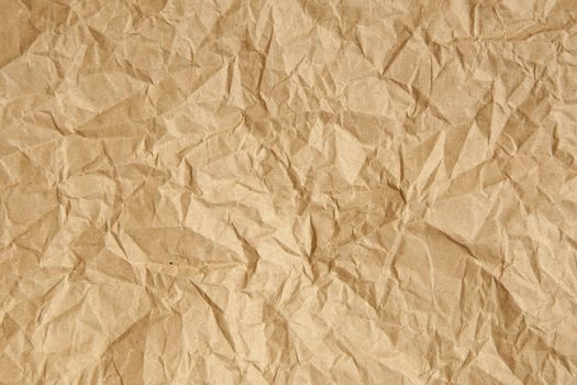 Crumpled brown parcel packing paper background texture
