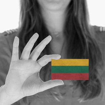 Woman showing a business card, flag of Lithuania