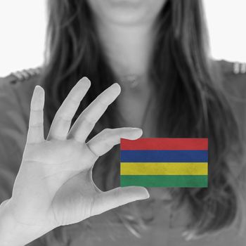 Woman showing a business card, flag of Mauritius