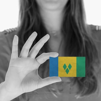 Woman showing a business card, flag of Saint Vincent and the Grenadines