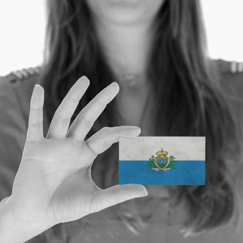 Woman showing a business card, flag of San Marino