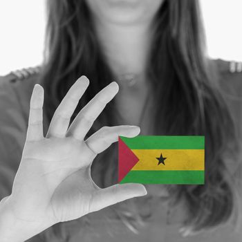 Woman showing a business card, flag of Sao Tome and Principe