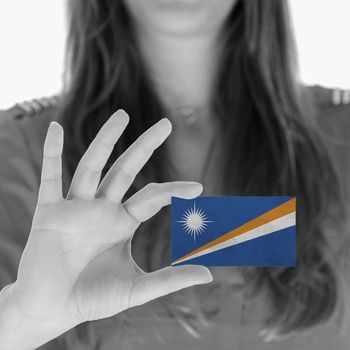 Woman showing a business card, flag of The Marshall Islands