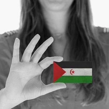 Woman showing a business card, flag of Western Sahara