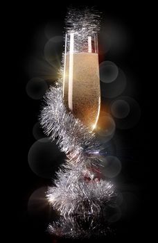 Glass of champagne with beautiful Christmas decorations