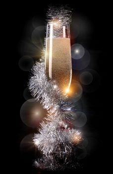 Glass of champagne with beautiful Christmas decorations