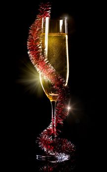 Champagne in glass on a black background