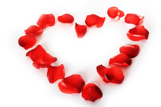 beautiful heart of red rose petals isolated on white 