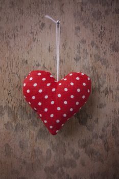 Red heart on wooden background 