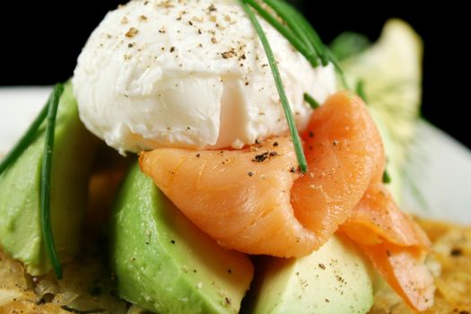 Beautiful salmon and poached egg stack with avocado.