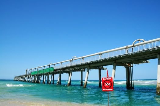 The old disused sand pumping jetty at The Spit on the Gold Coast in Queensland Australia.