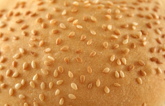 Sesame seed background from a bread roll.