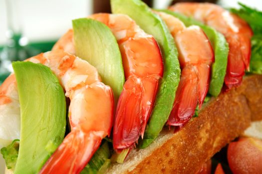 Delightful fresh shrimp and avocado open sandwich ready to serve.