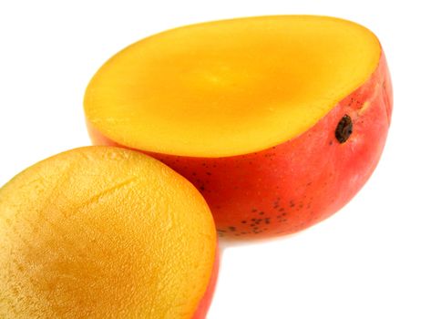 Fresh colorful mango sliced in half.