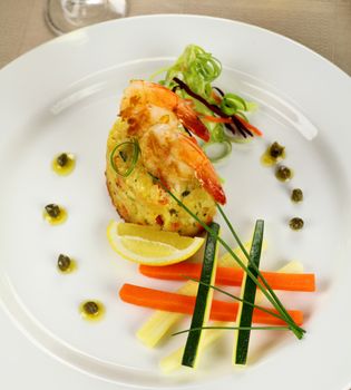 Delicious grilled shrimps on a risotto stack with side salad.