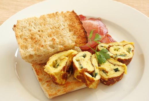 Delicious rolled omelette with bacon and Turkish bread.